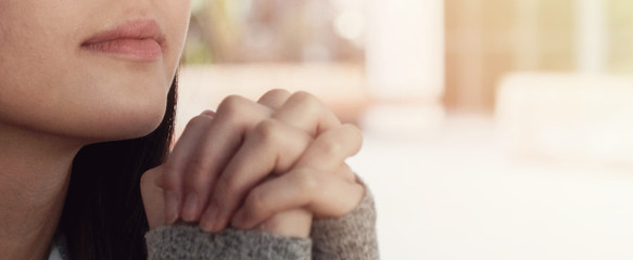 Young asian woman praying, teen prayer, hope, gratitude concept, online home church