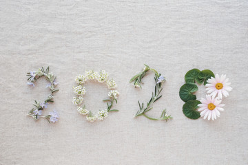 2020 made from tiny blossoms flowers and leaves, Happy New Year wellness decoration concept