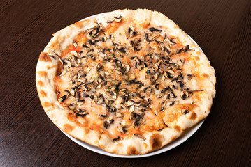 Bad, cheap pizza with mushrooms and cheese.