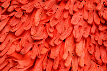 Many recycle orange Rubber gloves art wall texture background 