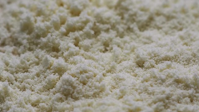 Whey protein powder fall on a rotating board