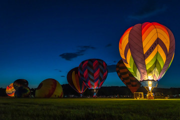 Hot air balloons at sunset at a balloon festival in Grants Pass Oregon