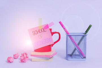 Word writing text School Of Engineering. Business photo showcasing college to study mechanical communication subjects Cup pens holder note banners stacked pads paper balls pastel background