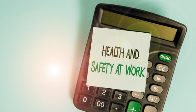 Text sign showing Health And Safety At Work. Business photo showcasing Secure procedures prevent accidents avoid danger Portable electronic calculator device blank sticky note colored background
