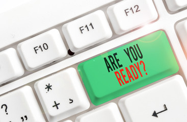 Text sign showing Are You Ready Question. Business photo text Setting oneself on the activity Being Prepared White pc keyboard with empty note paper above white background key copy space