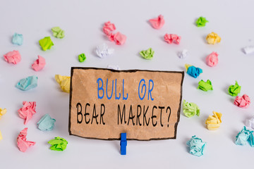 Text sign showing Bull Or Bear Market Question. Business photo text asking someone about his marketing method Colored crumpled papers empty reminder white floor background clothespin