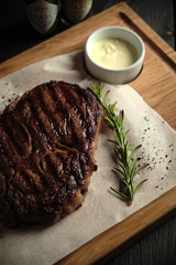 Meat steak on a wooden board. catering menu