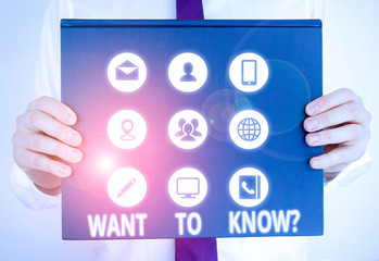 Handwriting text writing Want To Know Question. Conceptual photo Request for information Asking Wonder Need Knowledge Male human holding thick textured cardboard of business promotion concept