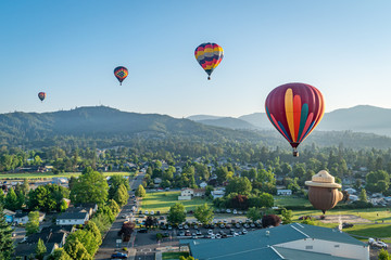 Colorful hot air balloons over Grants Pass Oregon on a beautiful summer morning