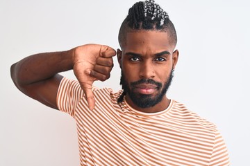 African american man with braids wearing striped t-shirt over isolated white background with angry...