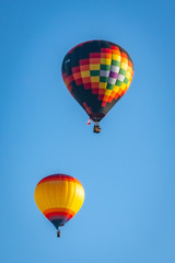 Colorful hot air balloon over Grants Pass Oregon on a beautiful summer morning