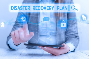 Text sign showing Disaster Recovery Plan. Business photo showcasing having backup measures against dangerous situation Female human wear formal work suit presenting presentation use smart device