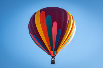 Colorful hot air balloon over Grants Pass Oregon on a beautiful summer morning