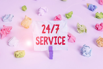 Handwriting text 24 Or 7 Service. Conceptual photo Always available to serve Runs constantly without disruption Colored crumpled papers empty reminder white floor background clothespin