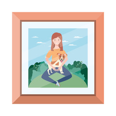 young woman lifting cute dog in picture