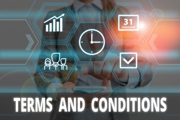 Writing note showing Terms And Conditions. Business concept for rules that apply to fulfilling a...