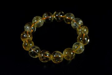 yellow Citrine Beads bracelet with black background