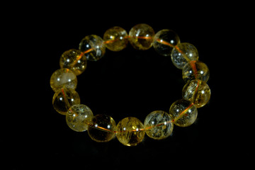 yellow Citrine Beads bracelet with black background