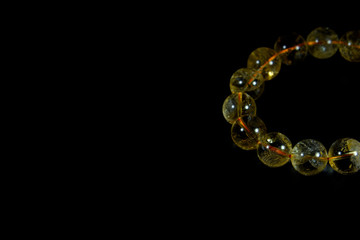 yellow Citrine Beads bracelet with black background
