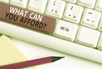 Conceptual hand writing showing What Can You Afford Question. Concept meaning Give us your budget availability of money White pc keyboard with note paper above the white background