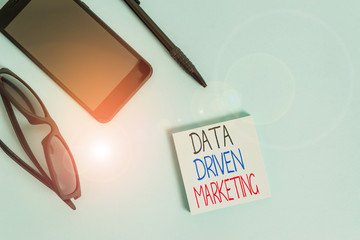 Handwriting text writing Data Driven Marketing. Conceptual photo Strategy built on Insights Analysis from interactions Eyeglasses colored sticky note smartphone cell pen cool pastel background
