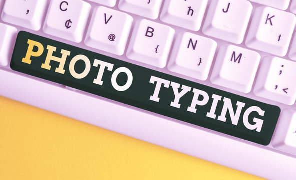Writing note showing Photo Typing. Business concept for metal printing block use to reproduce a photograph in printing White pc keyboard with note paper above the white background