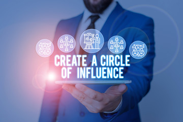 Handwriting text writing Create A Circle Of Influence. Conceptual photo Be an influencer leader motivate other showing Male human wear formal work suit presenting presentation using smart device