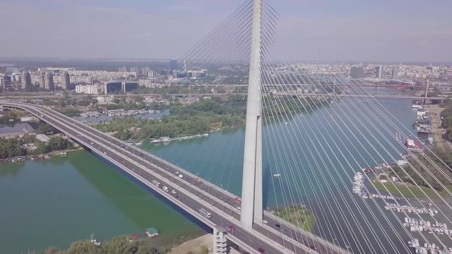 Slow ascending tilting shot of Ada bridge in Belgrade, Most na Adi Beograd