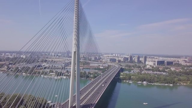 Beautiful 4k long aerial shot of Ada bridge in Belgrade and Sava river