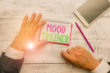 Obraz premium Conceptual hand writing showing Mood Trainer. Concept meaning a demonstrating who trains to alleviate mood disorders of a demonstrating