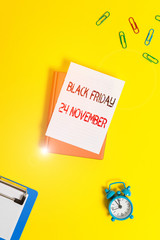 Writing note showing Black Friday 24 November. Business concept for Special sales Thanksgiving discounts Clearance Paper clips with blank papers for text messages