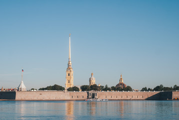 Naklejka premium Early morning sunrise with reflection on the water of the Neva river in St. Petersburg
