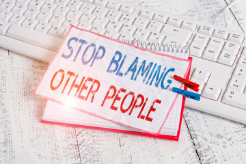 Word writing text Stop Blaming Other People. Business photo showcasing Do not make excuses assume your faults guilt notebook paper reminder clothespin pinned sheet white keyboard light wooden
