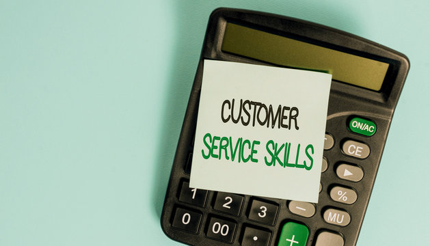 Text sign showing Customer Service Skills. Business photo showcasing Aptitude to master to improve dealings with client Portable electronic calculator device blank sticky note colored background