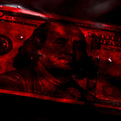 bloody business concept: 100 dollars banknote in a pool of blood