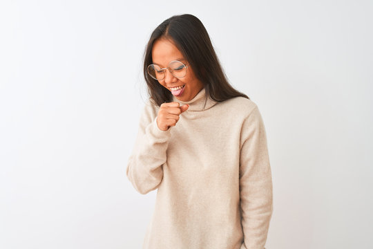 Young chinese woman wearing turtleneck sweater and glasses over isolated white background feeling unwell and coughing as symptom for cold or bronchitis. Healthcare concept.