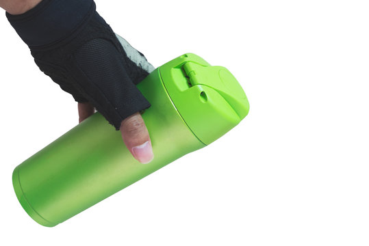 Hand holding stainless steel thermos mug for keeping temperature like iced of hot water, tumbler