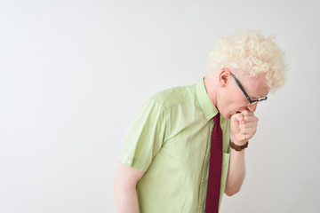 Young albino businessman wearing shirt and tie standing over isolated white background feeling unwell and coughing as symptom for cold or bronchitis. Healthcare concept.