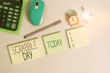 Conceptual hand writing showing Scrabble Day. Concept meaning a day to celebrate the popular board game created in 1938 Notepads alarm clock calculator sheet marker colored background