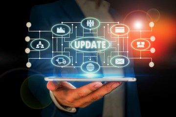Word writing text Update. Business photo showcasing by adding new information or making corrections Up to date Male human wear formal work suit presenting presentation using smart device