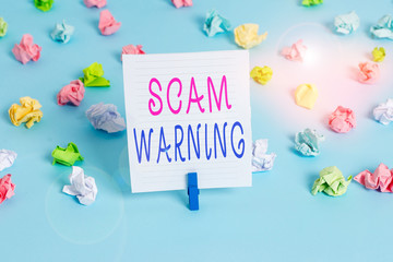 Conceptual hand writing showing Scam Warning. Concept meaning caution of unsolicited email claims...