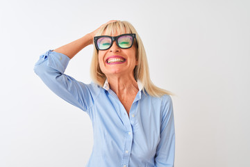 Middle age businesswoman wearing sunglasses and shirt over isolated white background stressed with hand on head, shocked with shame and surprise face, angry and frustrated. Fear and upset for mistake.