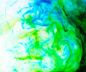 Fototapeta na wymiar Food color drop and dissolve in water for abstract and background.