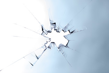 A splintered glass with a hole. Concept: broken glass