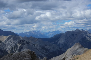 view of mountains with blue sky and clouds