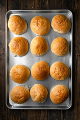 Top view Bun burgers preparing for cooking on wooden background / in lighting studio .