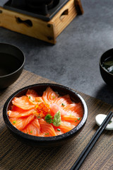 Salmon sushi rice don, Japanese food. Salmon sushi rice don on a bowl in lighting studio .