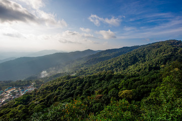 Wide natural background blurred by the bright sunlight above the mountains during the reversal of...
