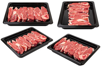 .Pieces of fresh raw meat in a black plastic container on a white isolated background. Ready for sale.