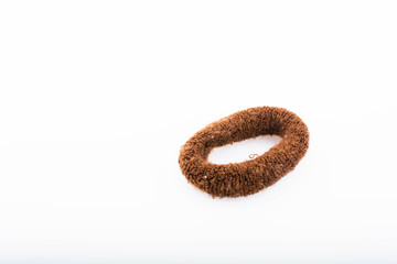 Close-up brown hair band isolated on a white background